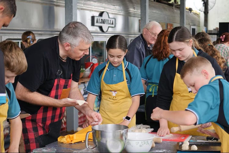 Chef teacher explaining to students