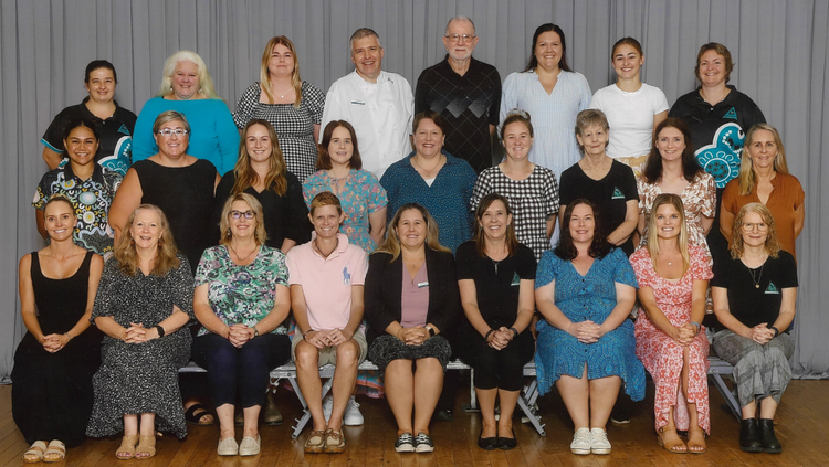photo of three rows of school staff
