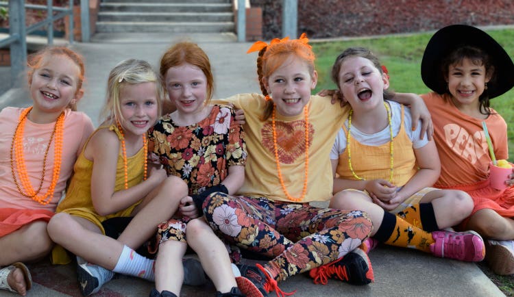 Students wearing orange in support of Harmony Day