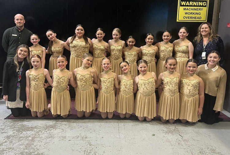 students smiling before dance performance